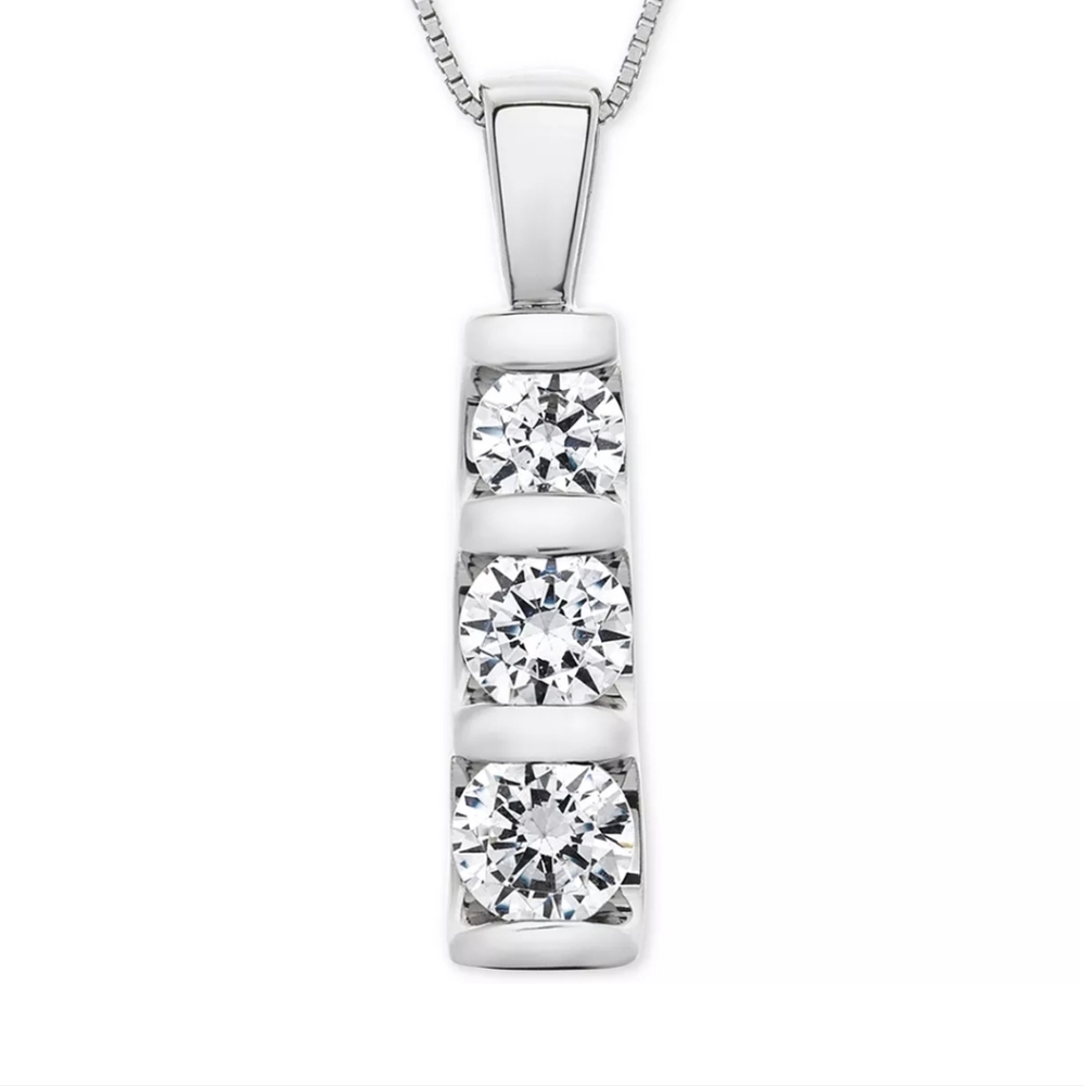 Pendant: Three diamonds in 14k white gold.